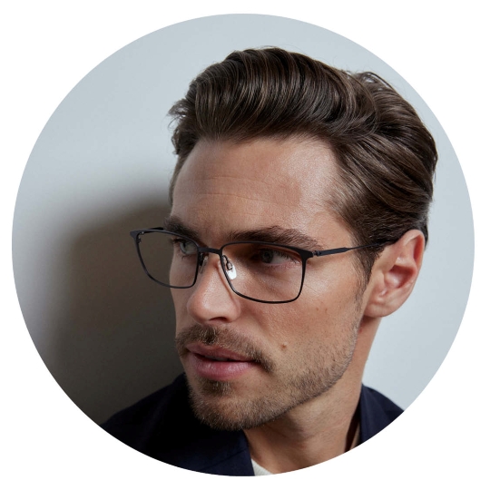 Close-up of man wearing CHARMANT Japanese Made premium eyeglasses close-up