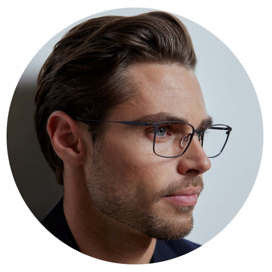 Man wearing CHARMANT Japanese Made titanium eyeglasses in side portrait