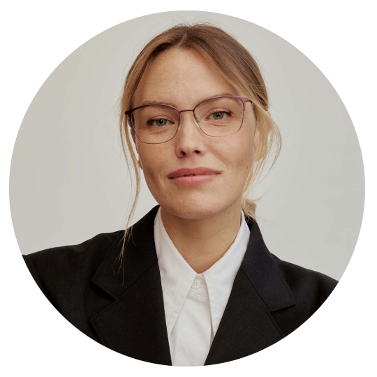 Portrait of woman wearing CHARMANT Japanese Made eyeglasses with MotionTech technology