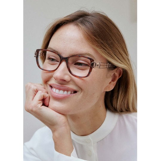 Close-up photo of woman wearing elegant Line Art CHARMANT eyeglasses.
