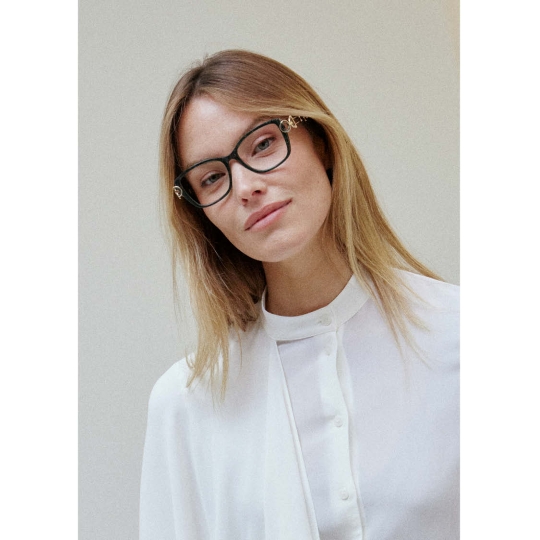Portrait photo of woman wearing lightweight Line Art CHARMANT eyeglasses.