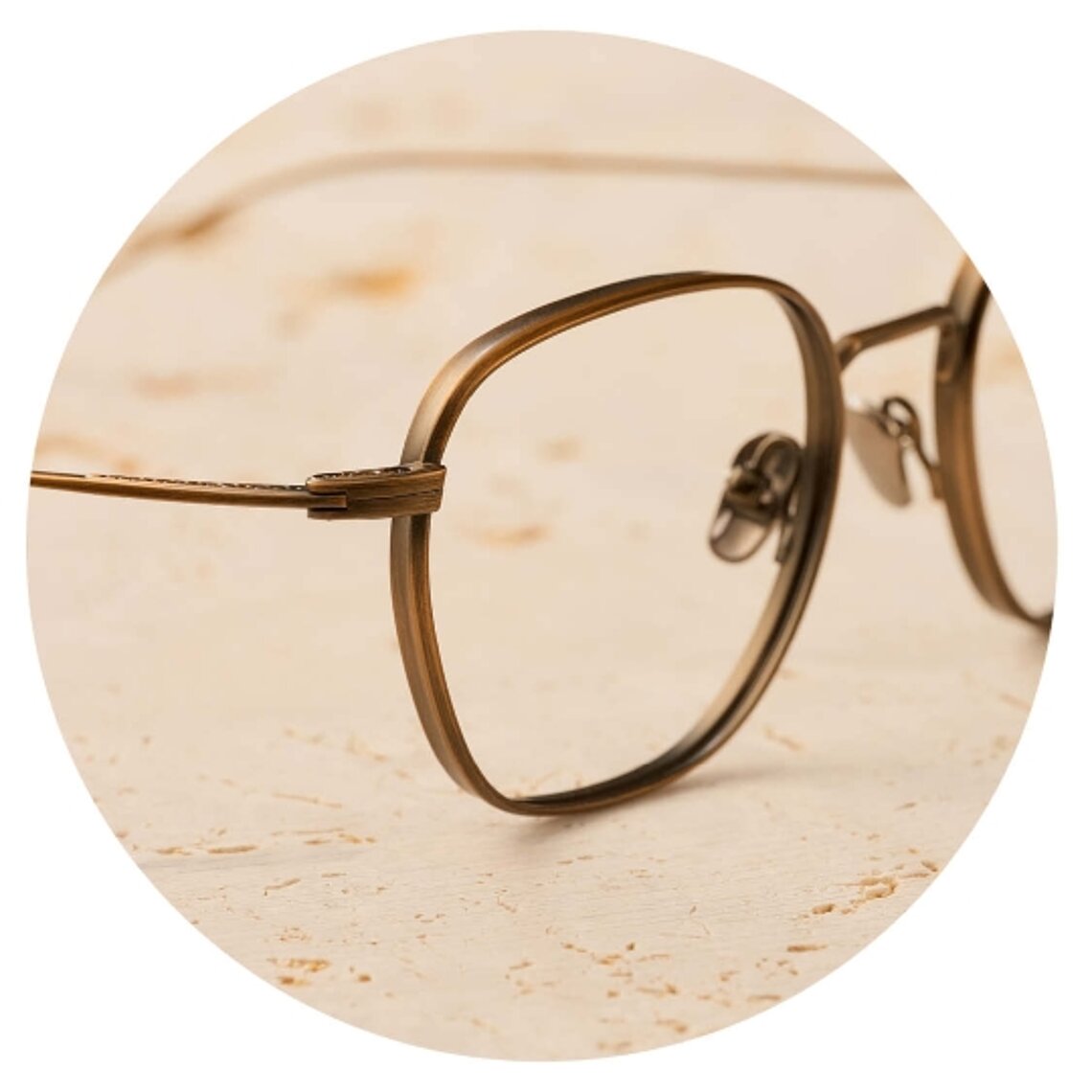 Close-up of Minamoto golden titanium eyeglasses with minimalist design
